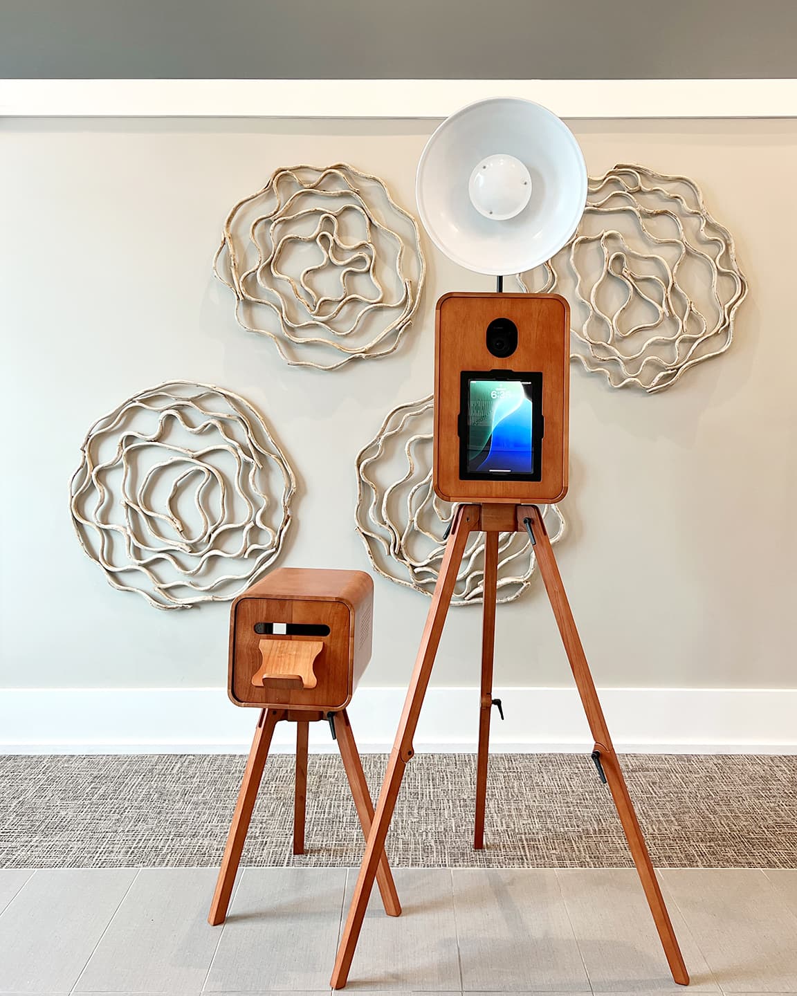 Tampa luxury wooden photo booth and printer setup with decorative wall backdrop